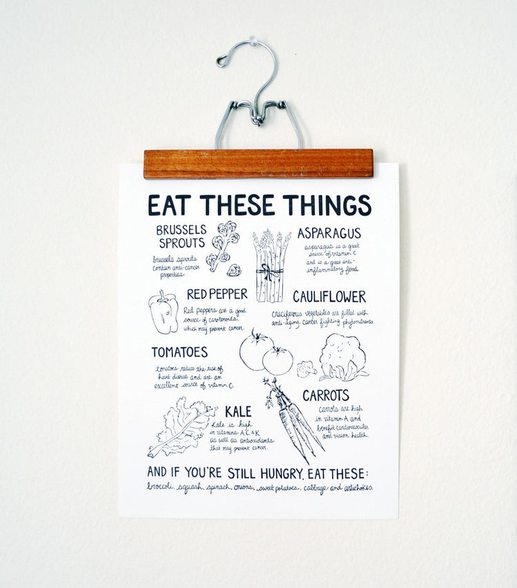 Eat These Things print on hanger display.