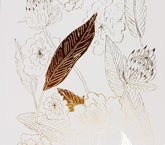 close up photo of Botanical art print with floral pattern in gold foil