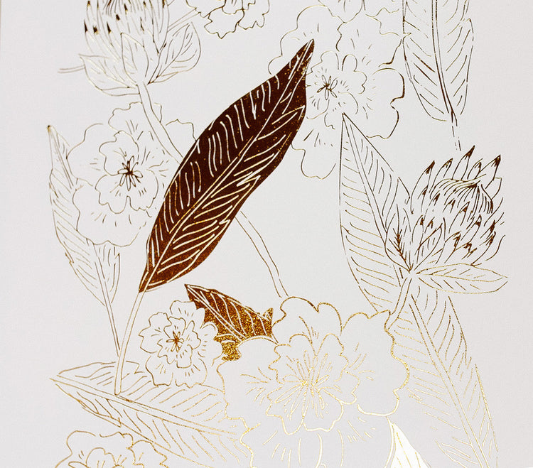 close up photo of Botanical art print with floral pattern in gold foil